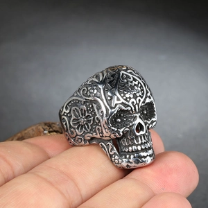 Vintage silver skull ring with sugar skull engravings for men, punk style on hand