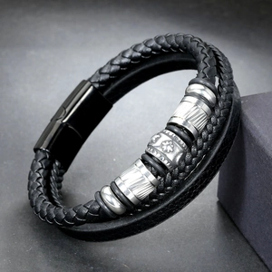 Close-up of multilayer leather bracelet with embossed silver beads and magnetic clasp
