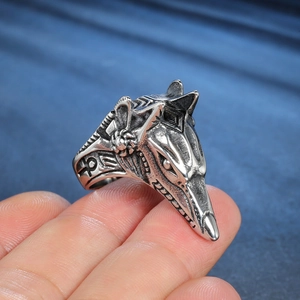Detailed close-up of vintage silver Anubis ring featuring intricate Ankh side carvings
