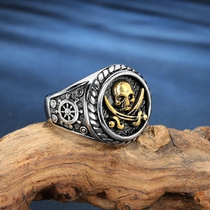 Vintage pirate skull ring in stainless steel with gold rudder and sword details
