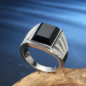 Men's retro stainless steel ring with rectangular black agate stone on wooden stand