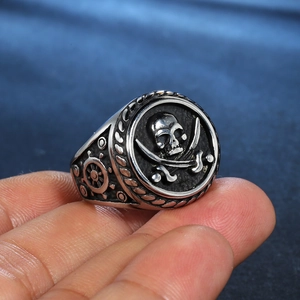 Vintage stainless steel pirate skull ring with cross swords and nautical helm patterns