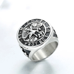 Macro view of St. Michael engraving on vintage stainless steel signet biker ring