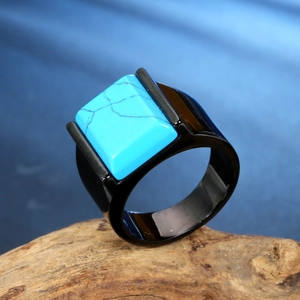 Men's square blue turquoise stainless steel ring on minimalist wooden stand