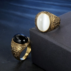 Vintage stainless steel ring set with black obsidian and white cat-eye stone inlay
