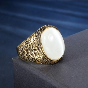 Vintage stainless steel ring with oval white opal stone and floral carvings