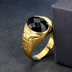 Vintage gold stainless steel ring featuring a large faceted black gemstone and side relief