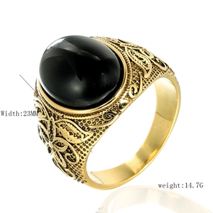 Vintage men's stainless steel ring with oval black obsidian stone and golden engraving