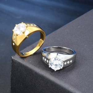 Set of gold and silver stainless steel rings with large round zircon in six-prong setting