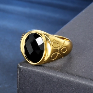 Vintage gold stainless steel ring with a large oval black gemstone and textured band