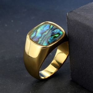 Men's gold-plated signet ring featuring a rectangular abalone shell inlay on gray background