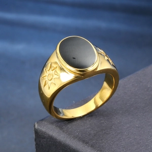 Vintage gold-plated signet ring for men with oval black onyx and sunburst side patterns