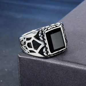 Vintage punk men's stainless steel ring featuring a black onyx stone and hollow carvings