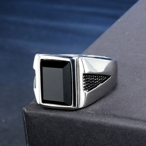 Men's stainless steel ring with rectangular black onyx gemstone and side textures