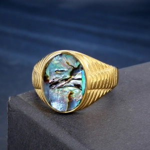 Golden anxiety ring with iridescent abalone shell inlay and striped engraving on band
