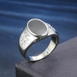 Vintage oxidized stainless steel signet ring with black oval stone and star carvings