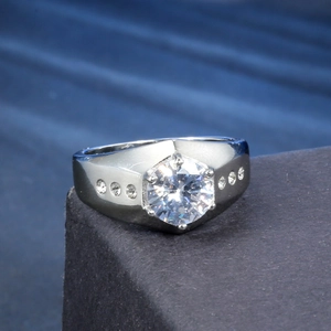Macro detail of silver stainless steel ring with large round zircon in hexagonal setting