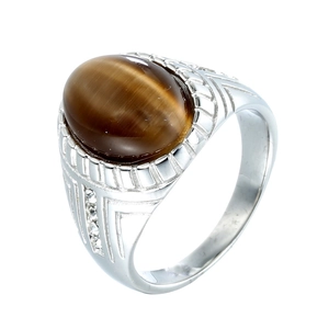 Macro detail of men's retro ring with oval brown tiger eye stone and side crystals
