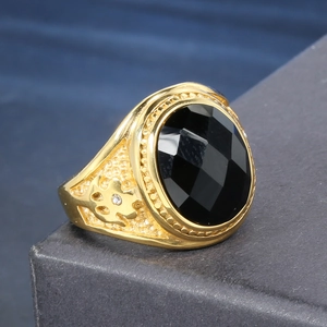 Vintage gold stainless steel ring featuring a large oval black gemstone and side relief