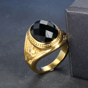 Vintage gold stainless steel ring with large faceted black stone and ornate carvings