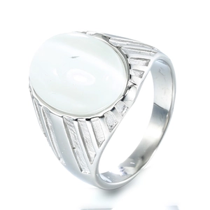 Macro shot of silver stainless steel ring with oval white stone and textured side grooves