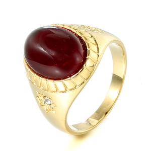 Vintage gold steel ring for men featuring a large oval mahogany gemstone and side accents