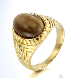 Golden ring featuring oval tiger eye stone with sparkling side stones at a 45-degree angle