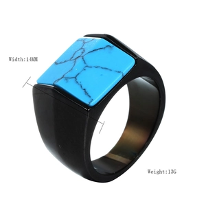 Macro shot of a 14mm wide men's black stainless steel ring with square turquoise inlay
