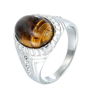 Vintage men's silver ring featuring a large oval tiger eye stone and carved textures