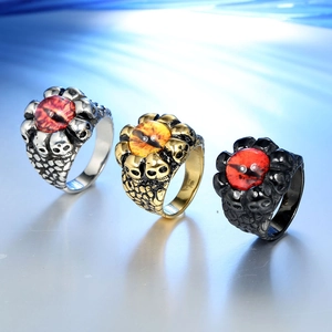 Detailed view of punk skull rings featuring colorful evil eye stones in different finishes