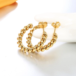 Golden twisted rope hoop earrings with spiral textured design and butterfly backing