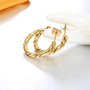 Polished gold twisted hoop earrings with textured spiral design for elegant daily wear