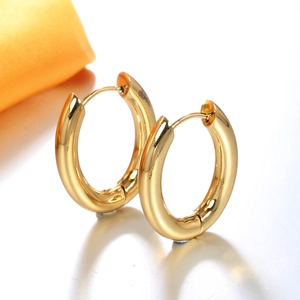 Elegant polished golden hoop earrings with classic round tube design on white background