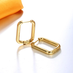 Detailed close-up of geometric U-shaped rectangular hoop earrings with polished gold finish