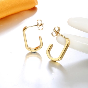 Detailed view of 18K gold-plated geometric U-shaped earrings with butterfly backings