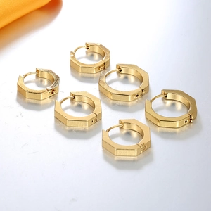 Set of six polished golden hexagonal hoop earrings in a minimalist geometric style