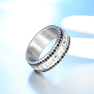 Mens stainless steel ring with black stones and pyramid studs in a three-row design