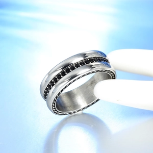 Macro view of silver titanium steel ring with black cubic zirconia and beaded edges