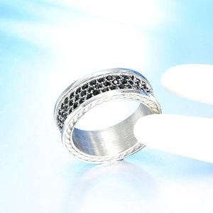 Close-up of titanium steel ring with triple row black zircon pave and rope edge details
