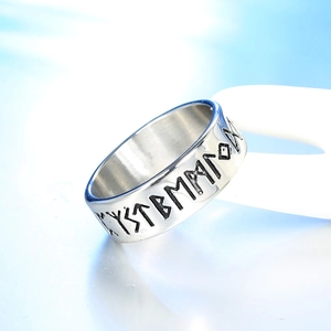 Nordic Viking rune titanium steel ring with vintage hollow engraving on white stand