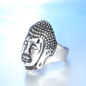 Detailed macro view of vintage Buddha head ring with silver antique finish and relief details