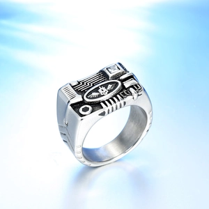 Gothic industrial ring with winged skull engraving and clear zircon stone detail