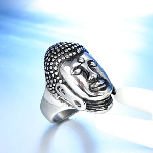 Macro detail of retro stainless steel Buddha ring with vintage oxidized finish on a stand