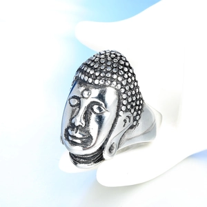 Vintage stainless steel Buddha head ring for men shown on white hand display stand