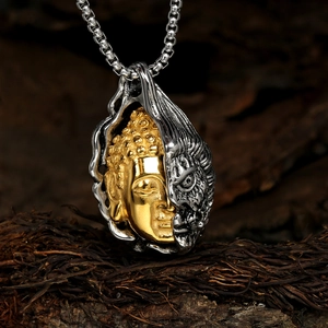 Macro detail of dual-face Buddha and Demon pendant with vintage steel finish