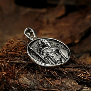 Spartan warrior medallion necklace in stainless steel on a rustic wooden background