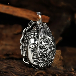 Titanium steel necklace pendant featuring a dual-faced Buddha and Demon sculpture design
