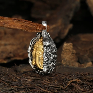 Retro two-tone stainless steel pendant featuring half Buddha and half demon design