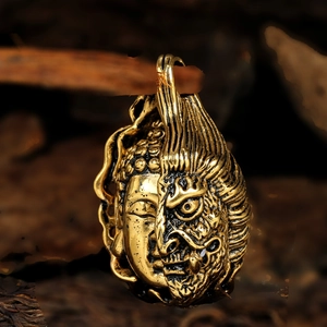 Detailed macro view of the dual-faced Buddha and Demon titanium steel pendant