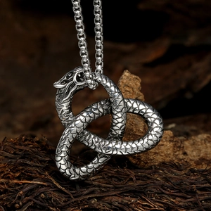 Retro silver twin snake pendant necklace with detailed scales and intricate textured design